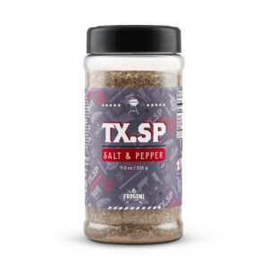 Bottle of Al Frugoni TX Salt & Pepper seasoning with coarse salt and black pepper scattered on wood table
