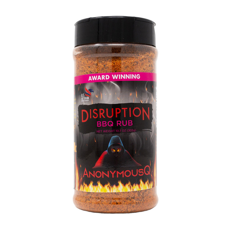 AnonymousQ Disruption BBQ Rub beside glazed ribs and brisket