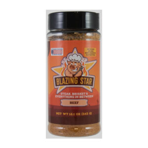 Bottle of Blazing Star Beef Rub & Seasoning beside grilled steak and smoked brisket