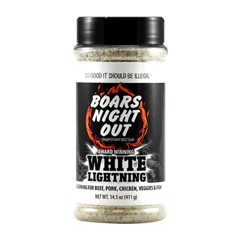Bottle of Boar’s Night Out White Lightning beside grilled steak and ribs