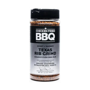 Bottle of Chicken Fried BBQ Rib Grind beside glazed ribs and pulled pork