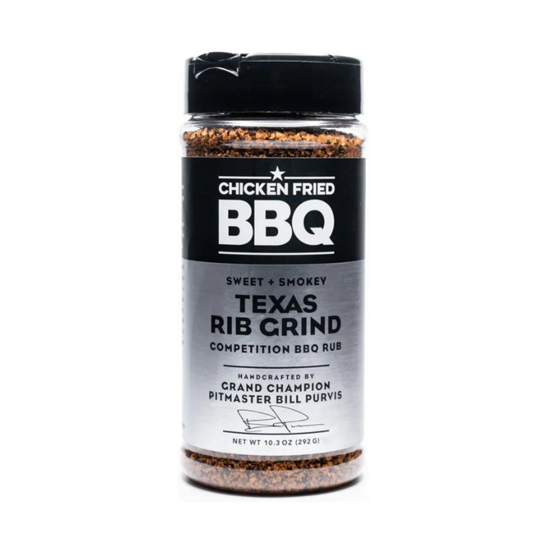 Bottle of Chicken Fried BBQ Rib Grind beside glazed ribs and pulled pork
