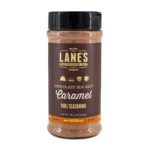 Lane’s Chocolate Sea Salt Caramel Dessert Rub jar beside brownies and sea salt flakes.