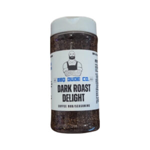 BBQ Dude Dark Roast Delight Coffee Seasoning bottle beside grilled steak and coffee beans.