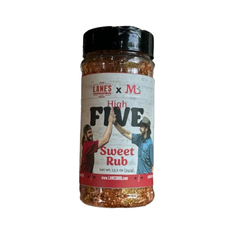 Lane’s McLemore Boys High Five Sweet Rub jar beside glazed ribs and grilled chicken.
