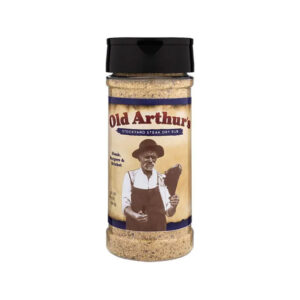 Old Arthur’s Stockyard Steak Dry Rub bottle beside grilled steak and rosemary sprigs.