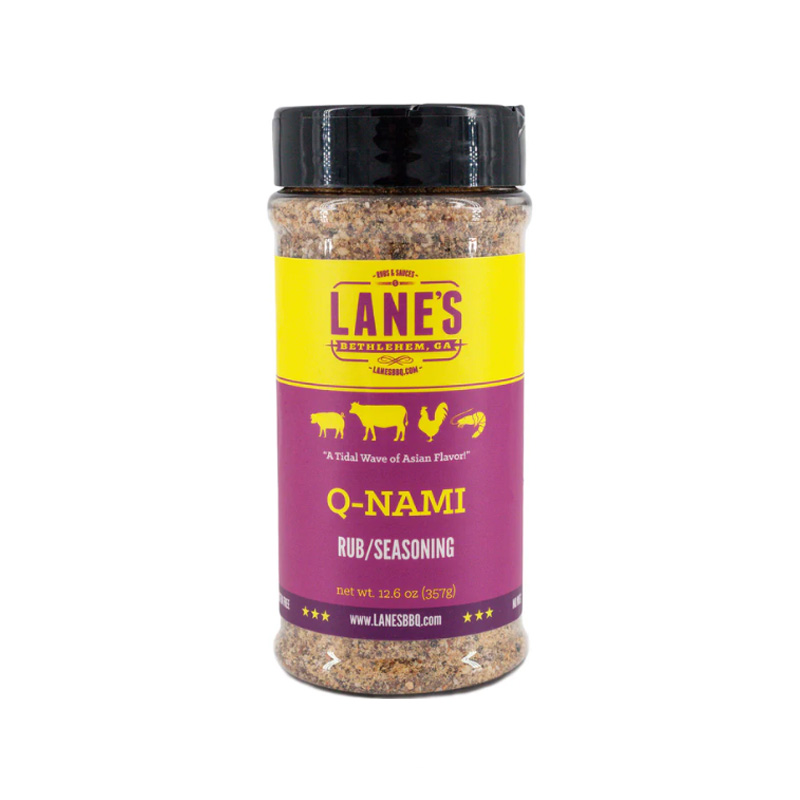 Lane’s Q-NAMI Rub jar beside grilled steak and sushi rolls.