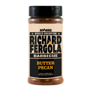 Bottle of Richard Fergola BBQ Butter Pecan Rub beside glazed ribs and chicken