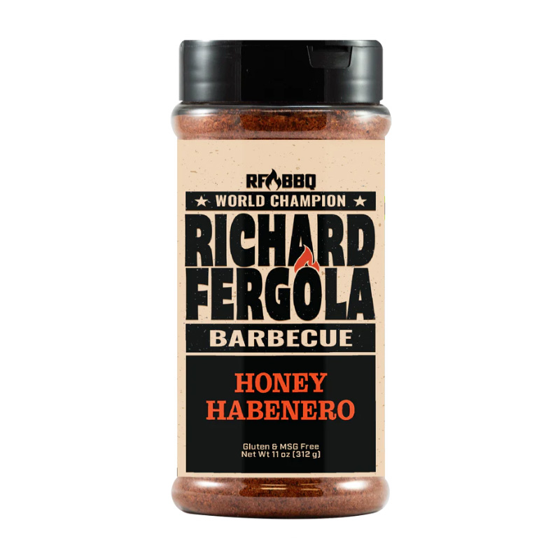 Bottle of Richard Fergola Barbecue Honey Habanero Rub beside smoked wings and ribs