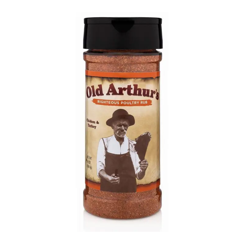 Old Arthur’s Righteous Poultry Rub jar beside grilled chicken and herbs.