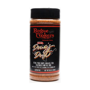 Bottle of Rogue Cookers Doug’s Dust seasoning beside grilled pork ribs