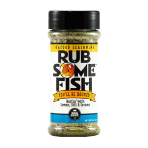 Bottle beside grilled salmon