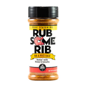 Bottle beside glazed ribs