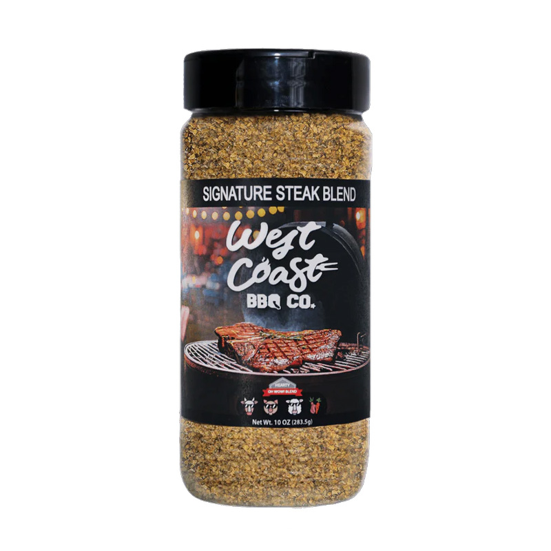 Bottle of West Coast BBQ Co. Signature Steak Blend beside grilled steak