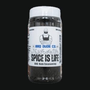 BBQ Dude Spice Is Life Seasoning bottle beside grilled chicken and chili peppers.