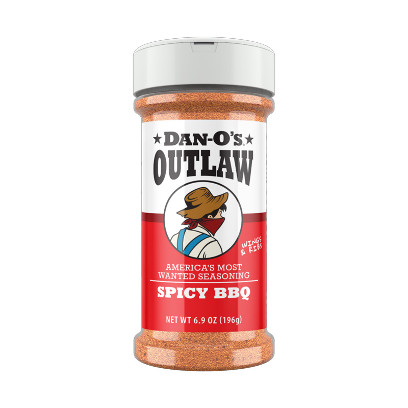 Dan-O’s Spicy BBQ bottle with ribs and smoke.