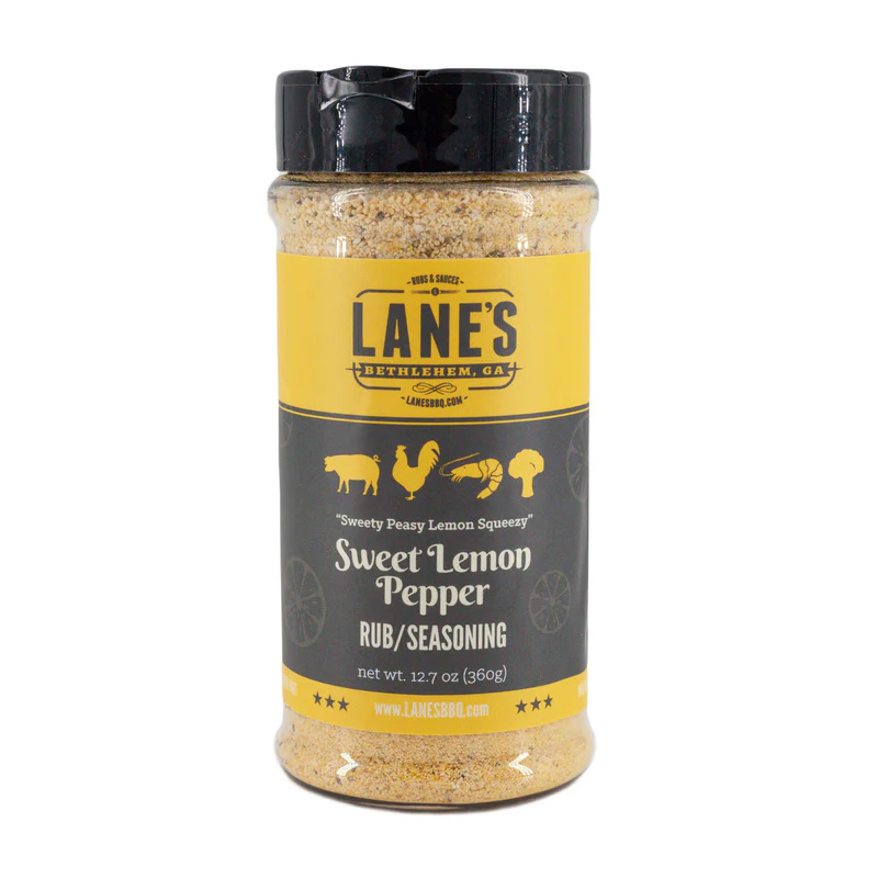 Lane’s Sweet Lemon Pepper Rub jar beside grilled salmon and lemon slices.