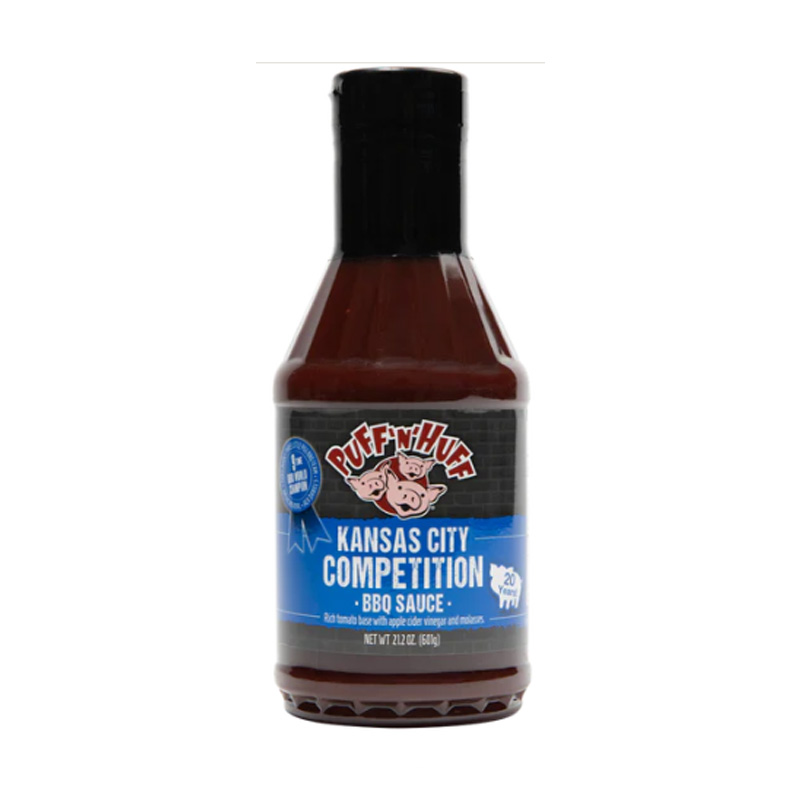 Bottle of Three Little Pigs Competition BBQ Sauce beside glazed ribs and pulled pork