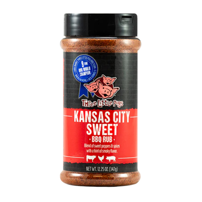 Bottle of Three Little Pigs Kansas City Sweet BBQ Rub beside glazed ribs and chicken