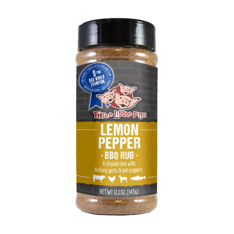 Bottle of Three Little Pigs Lemon Pepper BBQ Rub beside grilled chicken and fish