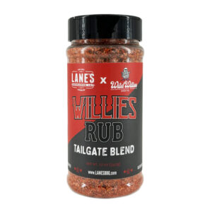Lane’s Wild Willies All-Purpose Rub jar beside grilled chicken and roasted veggies.