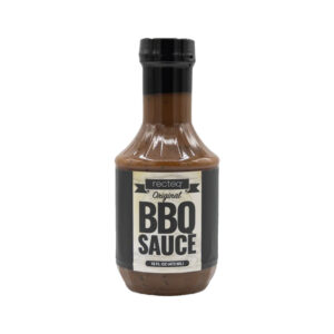 Bottle of Mild Gourmet BBQ Sauce on wooden background
