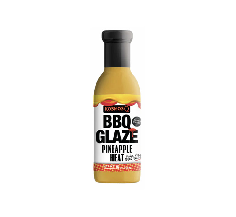 “Bottle of Pineapple Heat BBQ Glaze with glossy tropical sweet-heat finish”