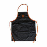 Waxed canvas BBQ apron front view with orange tie strings