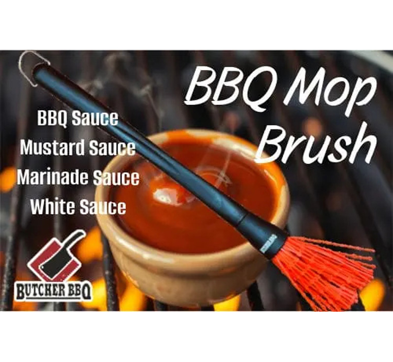 BBQ Mop Brush resting on sauce bowl over grill