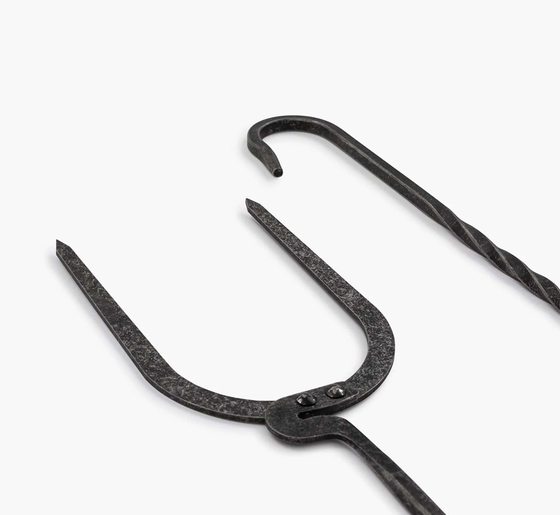 Close-up of forged steel roasting fork and twisted handle