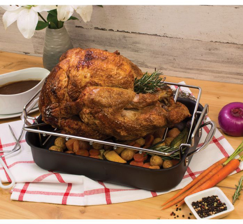 Side view of turkey on V-shaped roasting rack
