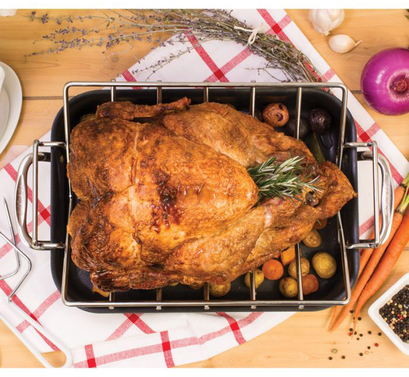 Turkey resting on V-shaped roasting rack