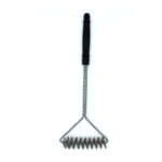 Outset coil grill cleaning brush in use