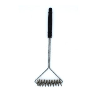 Outset coil grill cleaning brush in use