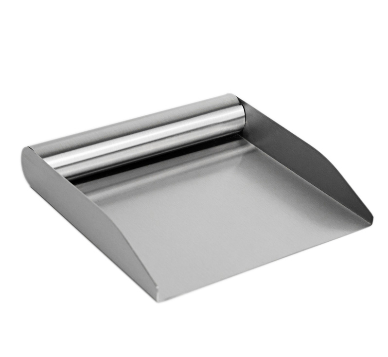 Person transferring chopped tomatoes with stainless kitchen food scoop