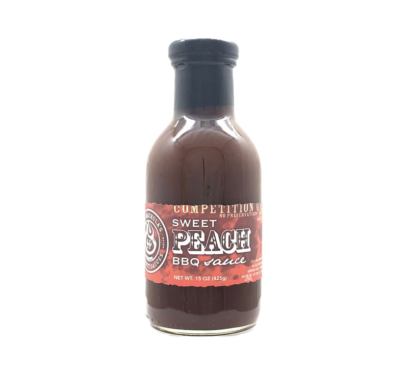 Bottle of Hot Wachula’s Sweet Peach BBQ Sauce with peach-themed label